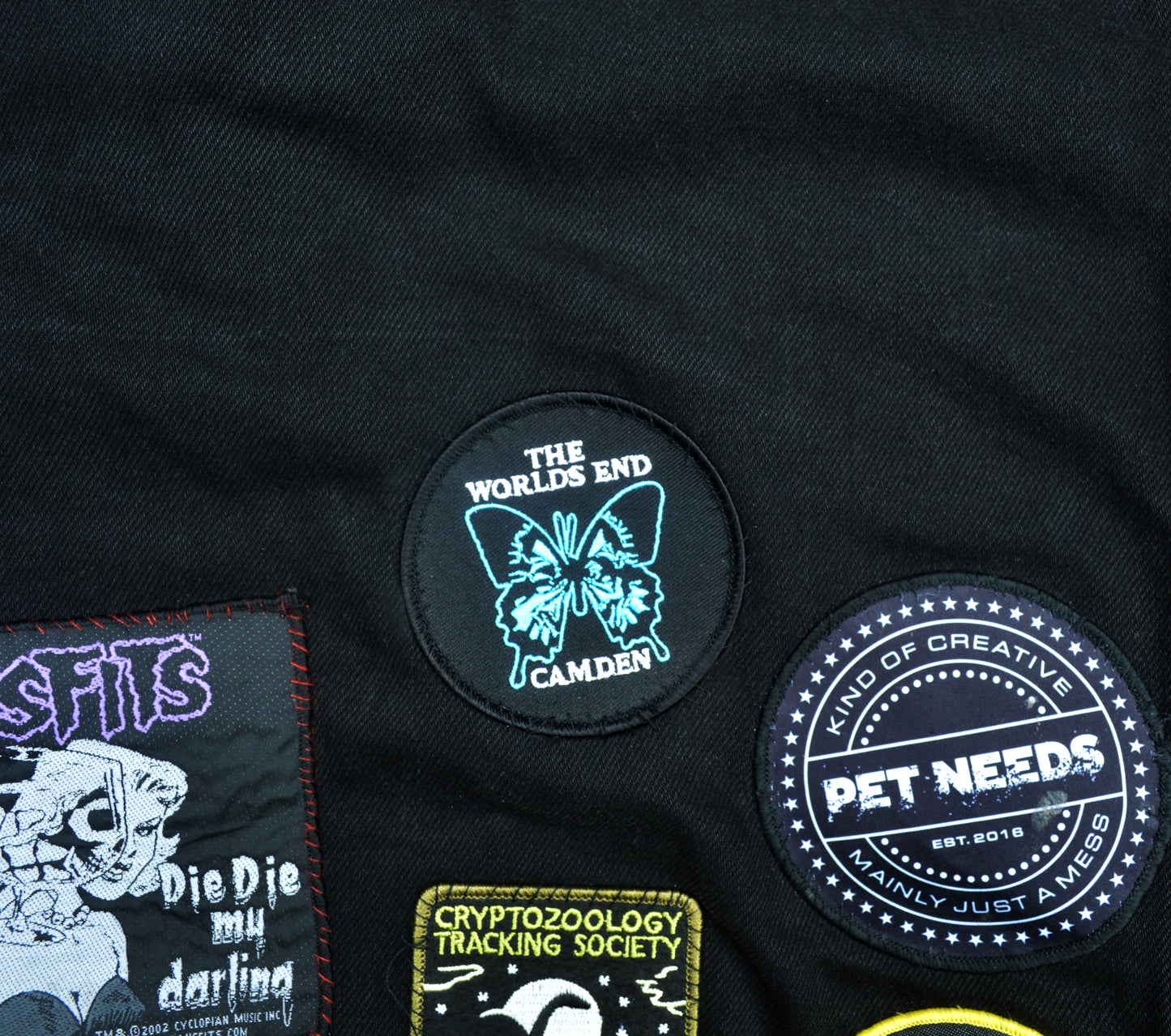 Patch with butterfly design sewn on a battle jacket. 